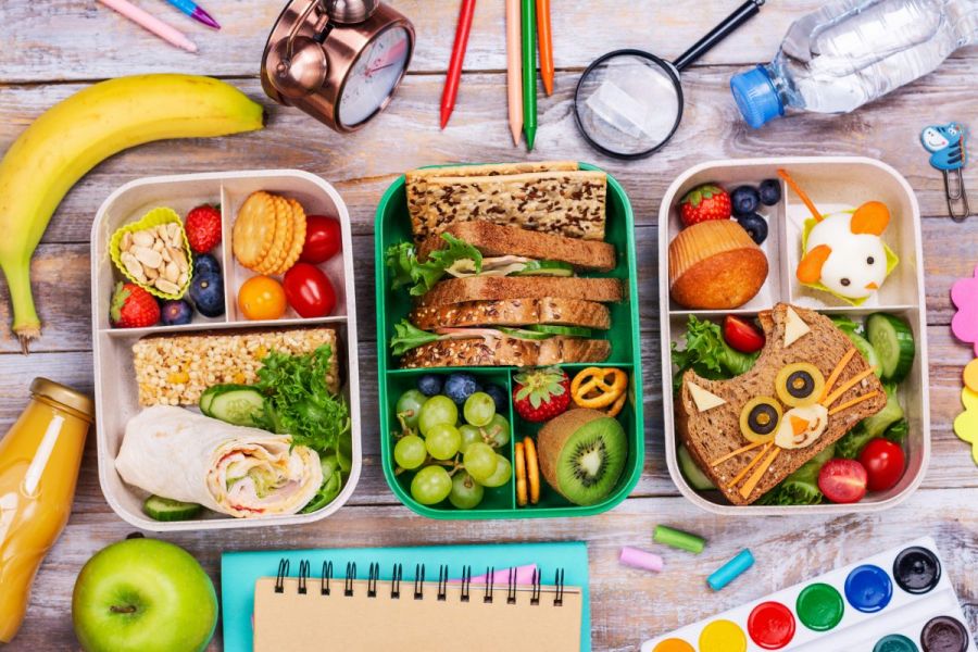 Three kid lunch box ideas, one with a wrap, one with a traditional sandwich and a creative presentation for the third.